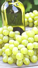 Closeup of a bottle of white wine and green grapes.