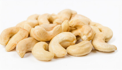 Fototapeta premium Heap of cashews isolated on white backdrop. Healthy and tasty snack. Super food.