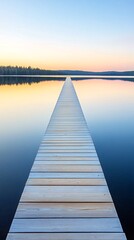 Naklejka premium Wooden dock extending into a calm lake at sunrise.