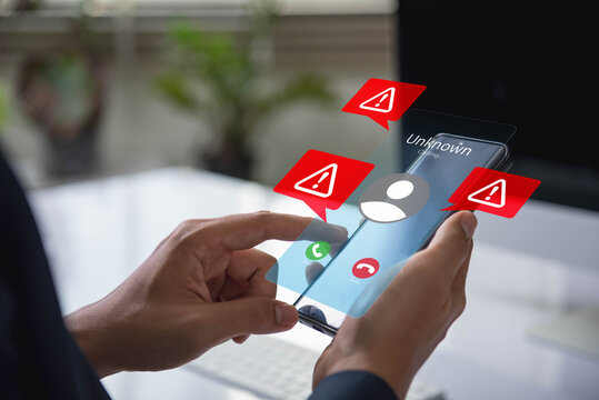 Scam or spam alert calls, Person receiving unknown scam alert call notification. Smartphone show danger signs of spam calls and cyber fraud, emphasizing the Importance of digital privacy and security