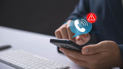 Scam or spam with warning alert calls, Person receiving a phone call alert with a scam warning...