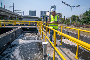 engineer under checking the industry cooling tower air conditioner is water cooling tower air...