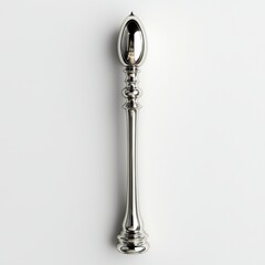 Elegant, long silver spoon with ornate handle against a plain background for culinary use.