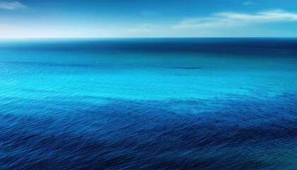 Obraz premium Vivid Ocean Gradient. Turquoise and Deep Blue Sea Waters Converge under a Clear Horizon. Perfect for Coastal Tranquility Concepts, Nature Scenes, or Oceanic Travel Destinations