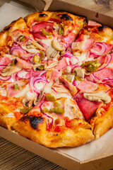 Fresh pizza in delivery box