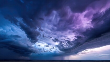 Obraz premium Majestic Twilight Sky with Deep Blue and Lavender Hues, Featuring Dramatic Cloud Formations and Soft Light Transitions. Ideal for Serene Landscapes, Dreamy Nature Themes, or Atmospheric Mood Backdrops