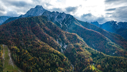 A stunning aerial view of Gozd Martuljek and its surroundings in autumn, captured by drone. The...