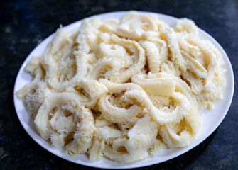 Beef tripe (bucho), beef stomach, tripe on a white plate. Dobradinha