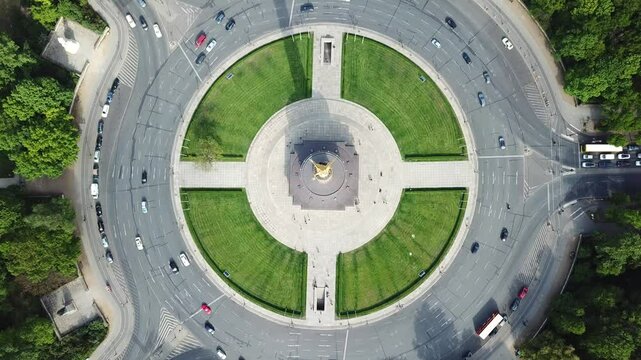 Aerial view, drone flying over Victory Column with car traffic around in Berlin, Germany