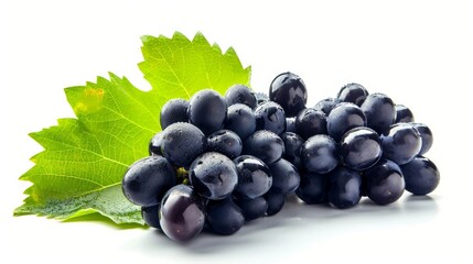 Fototapeta premium Exquisite and Wholesome: Vibrant Black Grapes Adorned with Lush Green Leaves on a Crisp White Canvas
