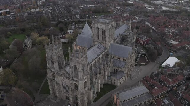Drone shot capturing York Minster, historic gothic cathedral, surrounded by urban landscape in York, England