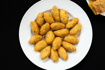 fried round pieces of salted cod traditional appetizer of the portuguese gastronomy, bolinhos de bacalhau
