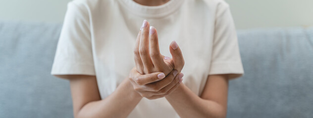 Close-up shot of human hands suffering from ligament inflammation on the palm.