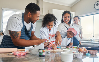 Happy family, kids and dough cutter for baking, teaching and shape flour in home kitchen. Mother, father and children learning cooking to help with dessert, recipe and people prepare cookies together