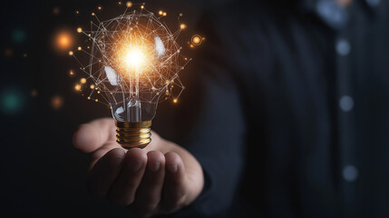 Businessman holding creative light bulb with growth graph, analytics icons. Utilizing analytics technology to develop new strategies and insights that enhance successful performance in global business