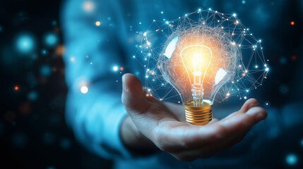 Businessman holding creative light bulb with growth graph, analytics icons. Utilizing analytics technology to develop new strategies and insights that enhance successful performance in global business