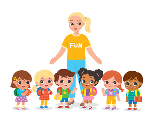 Group of elementary school children and teacher standing in the classroom and talking to each other. Happy teacher and kids meet and make friends at school.