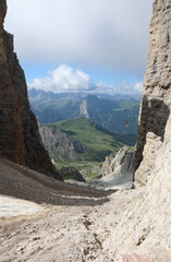 steep gully made of rocks and stones to reach the valley along a tiring and demanding path of the European Alps