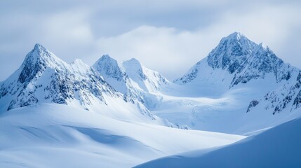 Obraz premium Snowy peaks of the Alaska Range with a blank sky for copy space