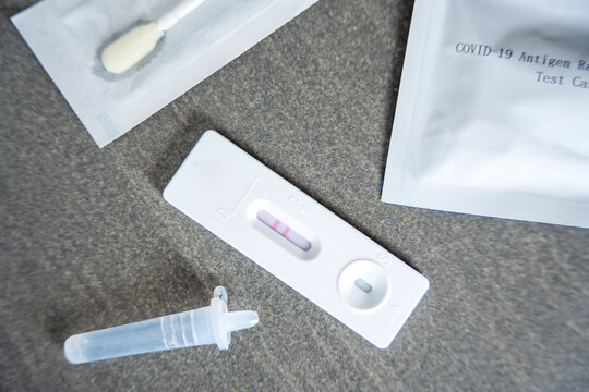 Rapid Antigen Test kit with with Positive result during swab COVID-19 testing. Coronavirus Self nasal or Home test, Autumn exacerbation of viruses