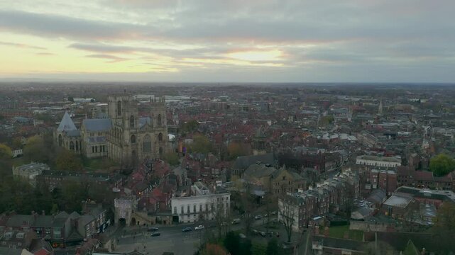 Wide aerial view of York city with sunset skies and prominent buildings including York Minster in England, UK