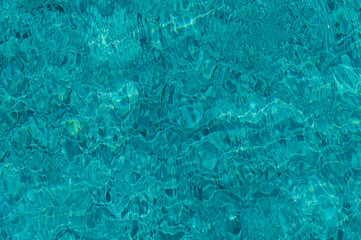 The Tranquil Ripples of Sunlight Dancing on Crystal-Clear Water During a Serene Afternoon