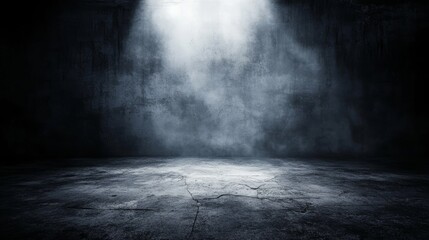 Solitary beam of light pierces the darkness of a room, illuminating the vast emptiness