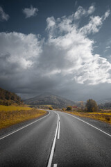 country road in autumn mountain landscape