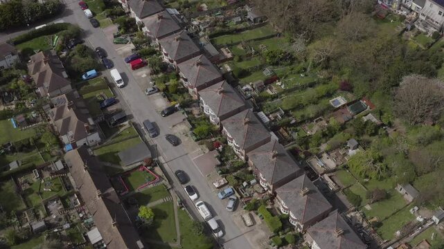 Top down birdseye aerial of a residential street with houses and gardens in Hastings, England