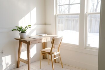 A sleek home office space featuring a minimalist desk in light oak wood against a backdrop of creamy white walls