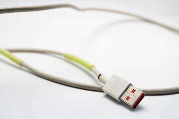 Fototapeta premium USB cable type C tangled over white isolated background