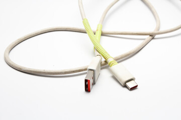 USB cable type C tangled over white isolated background