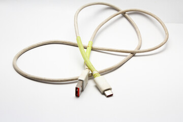 Fototapeta premium USB cable type C tangled over white isolated background