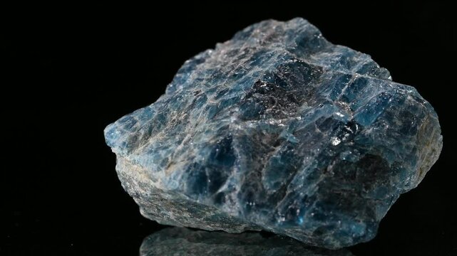 Apatite (calcium phosphate) sample rotating slowly against a black background. [Madagascar]
