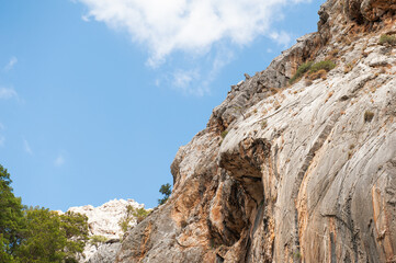 Majestic rocky cliff against a sky, showcasing rugged natural beauty