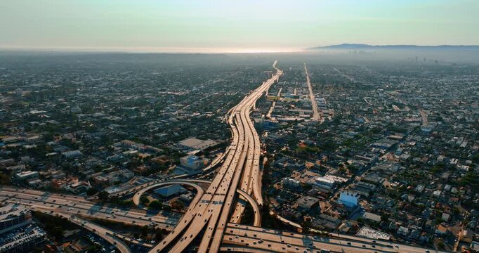 Busy traffic on the highways of Los Angeles, California, USA. Aerial perspective on vast panorama at daytime.