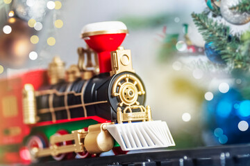 Toy train on the Christmas tree. New Year and Christmas concept