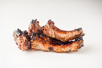 White Isolated Grilled BBQ Ribs with Red Sauce Pork and Beef Roasted on Charcoal Gourmet Meal