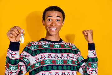 Photo of funky young guy hold keys winning dressed ornament christmas garment celebrate winter...