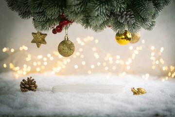 Christmas Holiday background with snow, fir tree and decorations with christmas light behind....