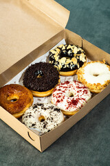 a box of donuts with various flavors