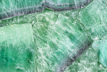 Close-up of green crystal stone texture, ideal for natural patterns, backgrounds, or decorative elements.