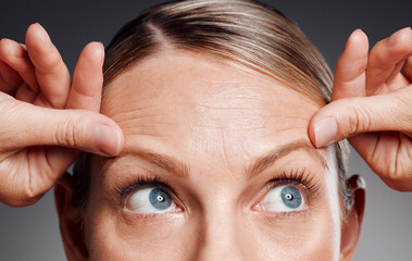 Mature woman, thinking and anti aging for cosmetics, glow and skincare on studio background. Female...