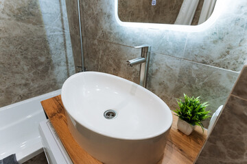 A bathroom that includes a sink along with a mirror is a vital space in any home for personal care...