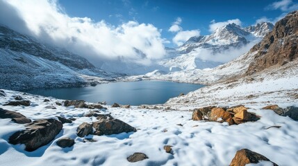 mountain range with snow-white peaks in far away in low clouds