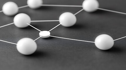Fototapeta premium White spheres connected by thin threads on a dark background.