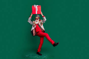 Full size photo of isolated on excited aged m an hold christmas giftbox empty space dark green...