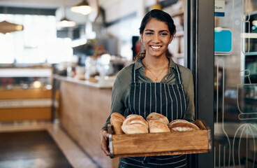 Woman, portrait and happy in cafe for bread, service expert and startup development with apron. Entrepreneur, face and confidence in bakery for small business, pride and franchise ambition with food