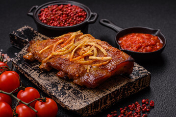 Pork or beef ribs with salt, spices and herbs baked on the grill