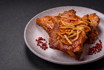 Pork or beef ribs with salt, spices and herbs baked on the grill